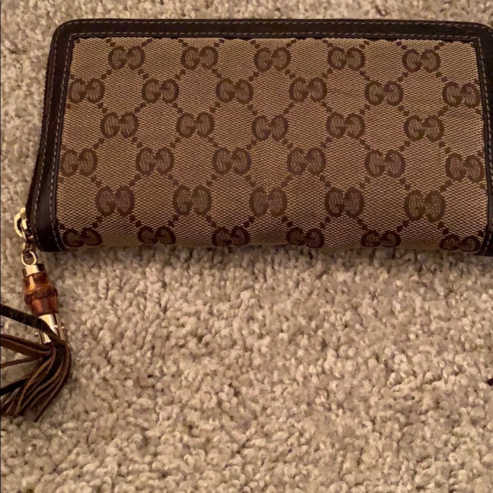 Gucci canvas zip around wallet .Bamboo tassel